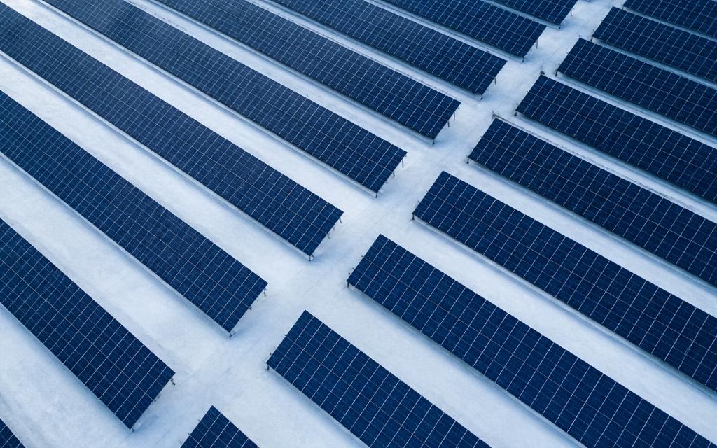 Aerial view of utility-scale solar panel arrays